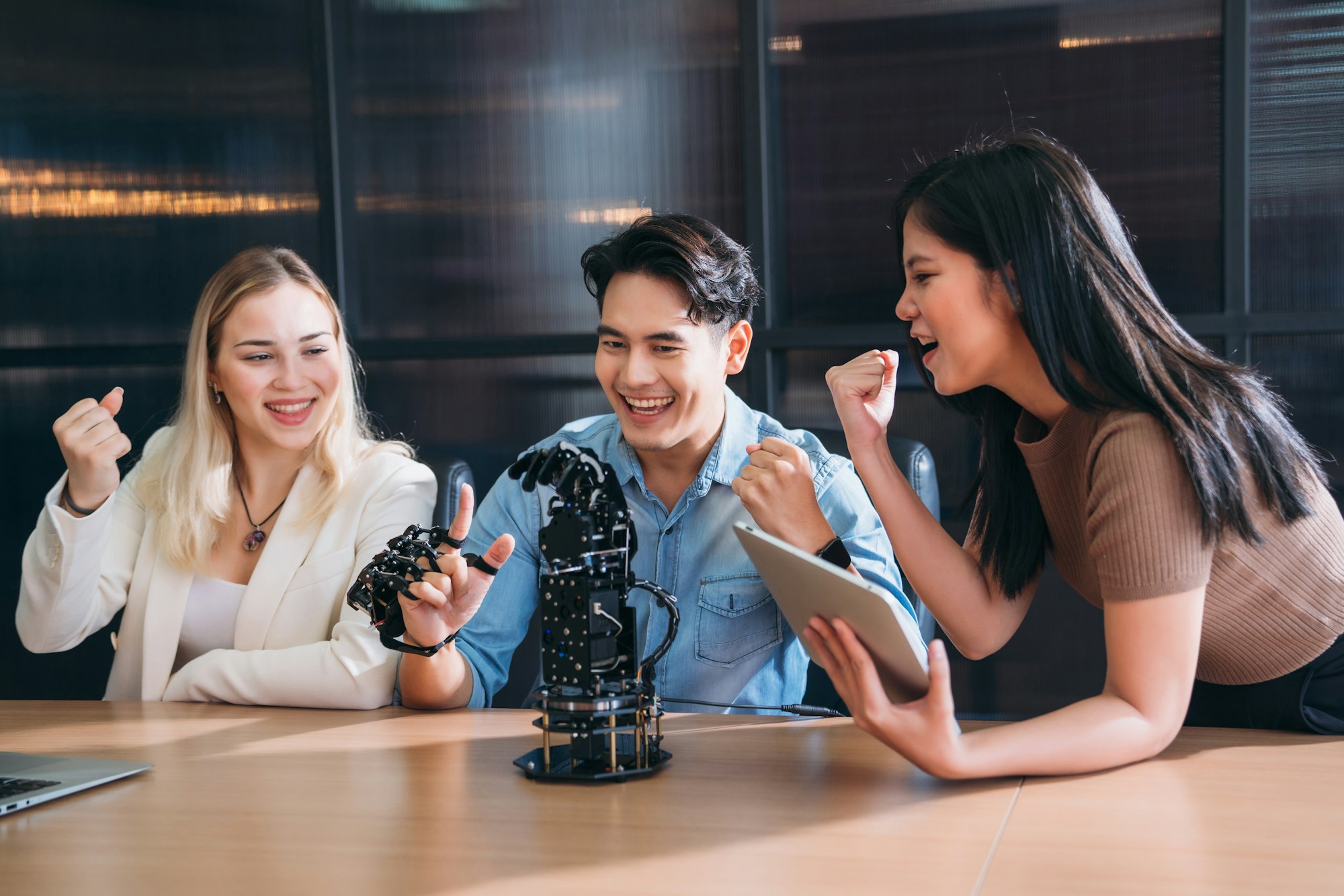 College Students research inventions robotics and robot arm. Experiments and digital automation.